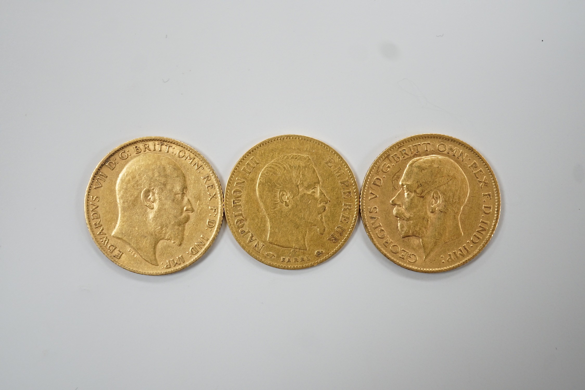 Two gold half sovereigns, 1904 & 1911 and a French gold 1859 10 franc coin.